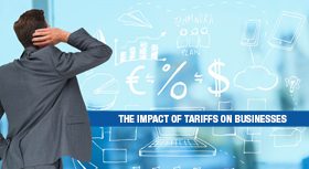 Businessman looking at financial sketches with a banner about tariffs.