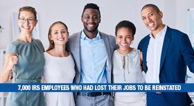 Happy business team with a banner about reinstating IRS employees.