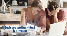 Two people looking at a document