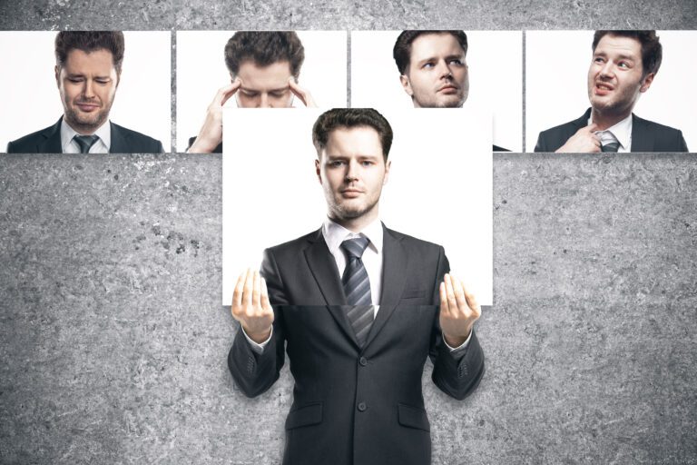 A man holding a white sign, with four different facial expressions shown above him.